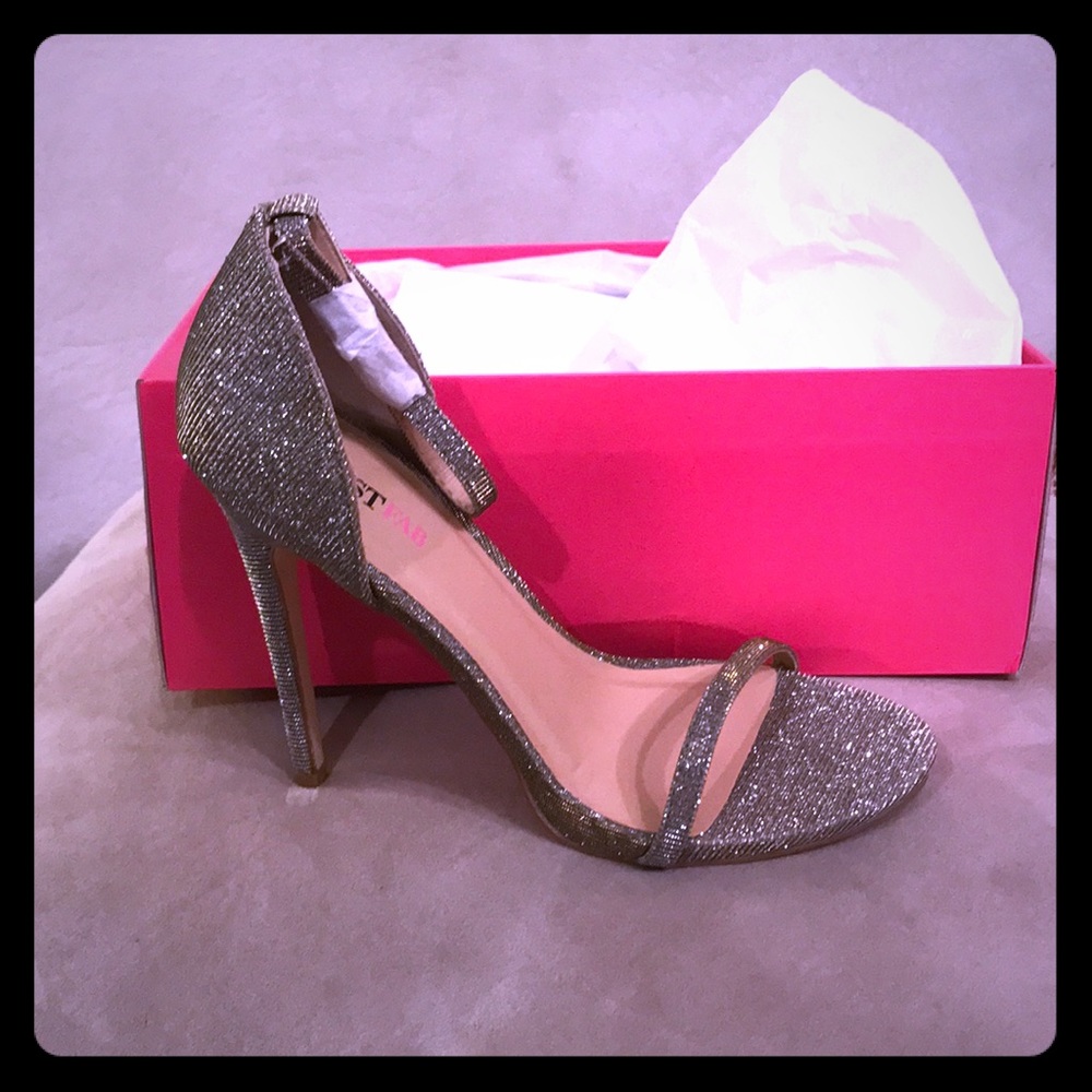 Gold sparkly high heels. New in box
